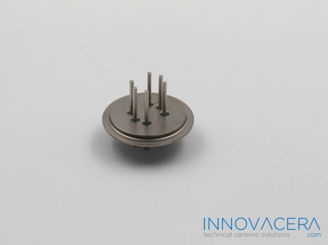 Glass to metal sealing mechanism