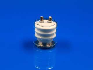 Dual-pin ceramic-to-metal vacuum power feedthrough with optional quartz shield for thermal evaporation coating equipment