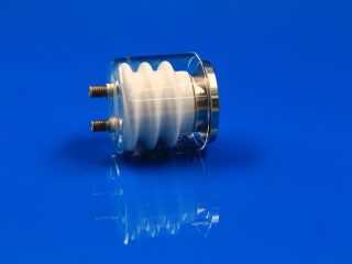 Dual-pin ceramic-to-metal vacuum power feedthrough with optional quartz shield for thermal evaporation coating equipment