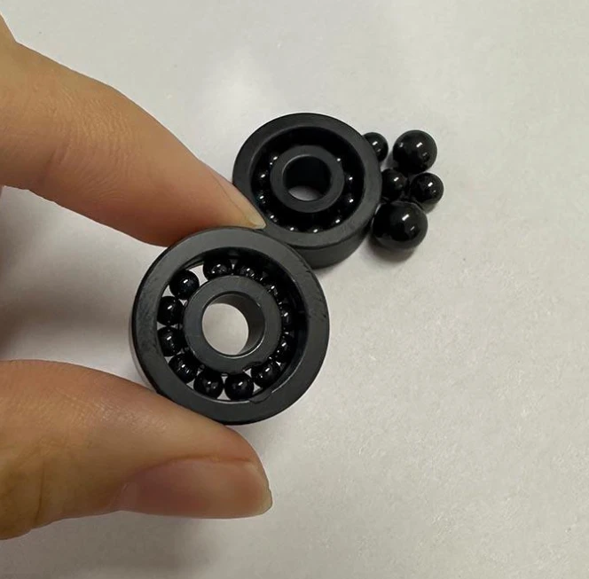 High-speed hybrid ceramic bearing elements with silicon nitride balls